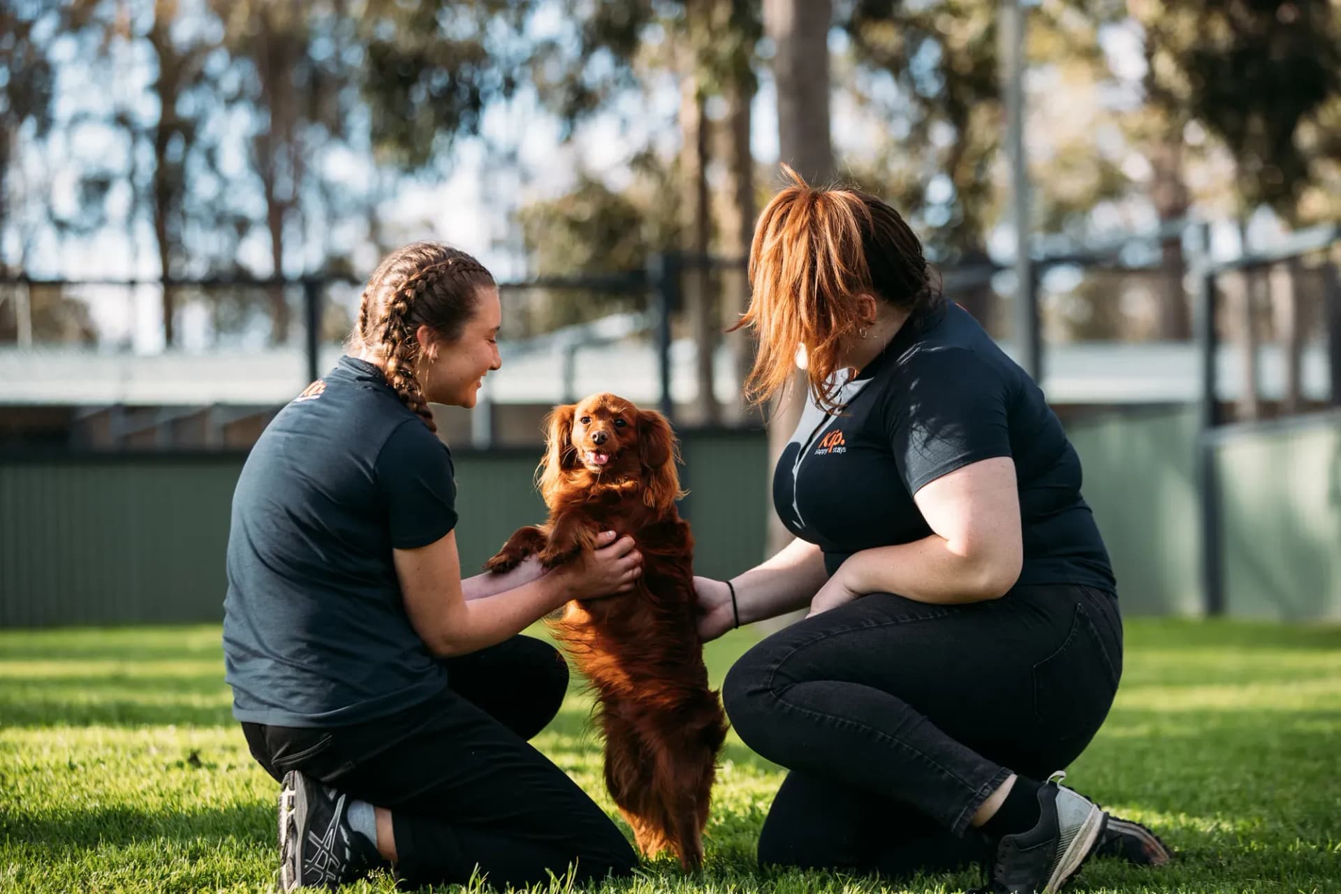 Two Kip employees with a dog